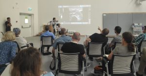 Group examining ultrasound pictures קבוצה בוחנת תמונת אולטר-סאונד